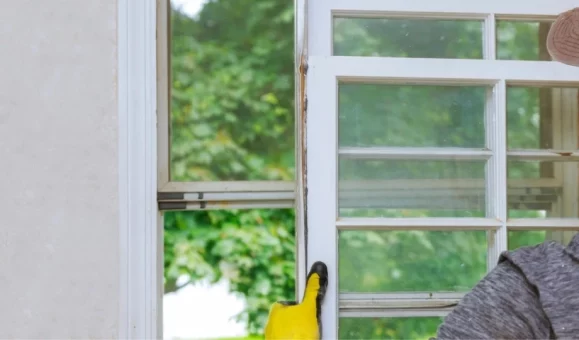 A Windows Repair Brussels technician performing a professional window repair on a home in Brussels